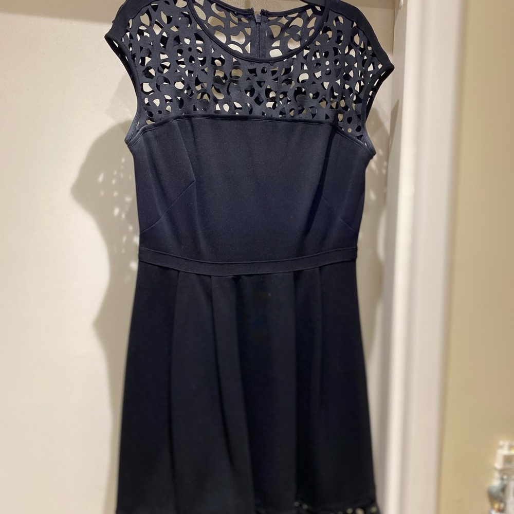 Gorgeous black Ralph Lauren dress with laser cut detail at neck and hem